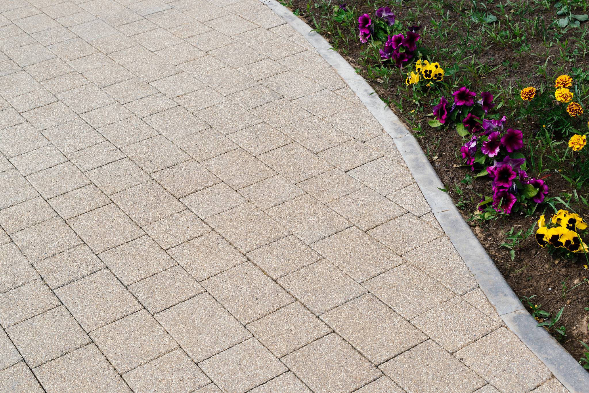 Patterned paving tiles and cement floor
